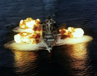 Battleship USS NEW JERSEY BB 62 firing nine 16 inch/50 caliber guns 