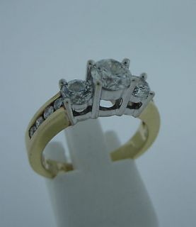   Gold 3 Stone Diamond Ring with .65 carat Brilliant Cut Center Stone