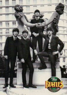 The Fab Four Posing in Suits and Ties around Statue     Beatles 