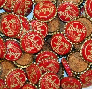 Soda pop bottle caps Lot of 25 DUKOLA baby pictured cork lined new old 