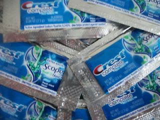 LOT OF 300 SINGLE USE PACKETS OF CREST COMPLETE W/SCOPE TOOTHPASTE