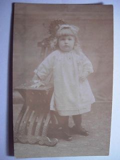 Old rppc UNUSUAL ANTIQUE WOODEN CHAIR & FAT CHEEKED LITTLE GIRL 