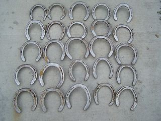 25 used horseshoes steel some nails
