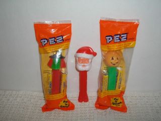   HEAD~WITCH~SAN​TA CLAUS PEZ CANDY DISPENSER~NEW IN PACKAGE w/CANDY