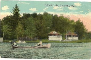 Man Woman Umbrella Rowing in Boat Baldwin Lake Greenville MI Michigan 