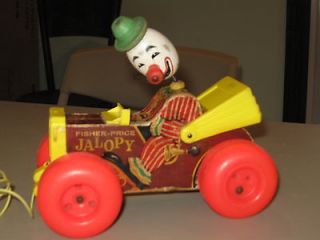   Vintage ca.1965 and 1967 Fisher Price pull toys Jalopy and Drummer Boy