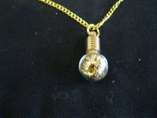 BALL PENDANT W/GOLD CHAIN FILLED WITH GOLD FLAKES