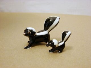 Two Little Skunk Figurines  Mama and Baby