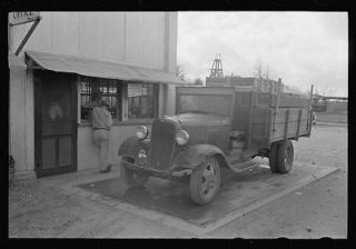 Crates of sweet potatoes being weighed at starch plant,Laurel,M 