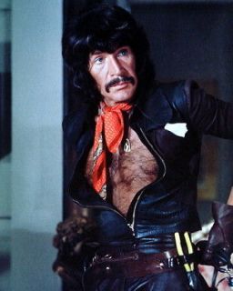 Peter Wyngarde as Jason King bare chest in open black leather shirt 