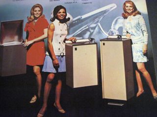 Vintage image of pretty ladies in mini skirts w/ G E water cooler 1969 