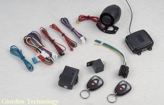CAR ALARM KEYLESS ENTRY SYSTEM WITH 2 FOUR BUTTON REMOTES NEW IN THE 