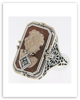   silver cameo onyx filigree flip ring there is onyx on one side with a