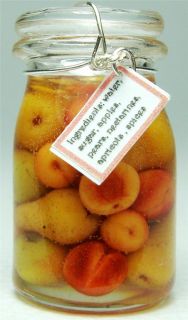 colorful jar containing apples pears nectarines and apricots so 