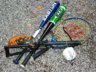 Lot of kids sports equipment   baseball bats glove tennis crossbow 