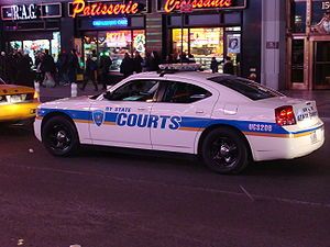 new york state court officers police car in times square