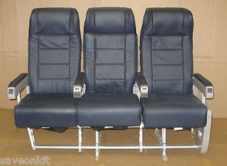 row of 3 leather airplane aircraft seats cinema waiting room