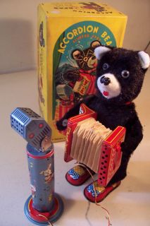    BATTERY OPERATED SM ACCORDION BEAR WITH TIN ACCORDION AND MICROPHONE