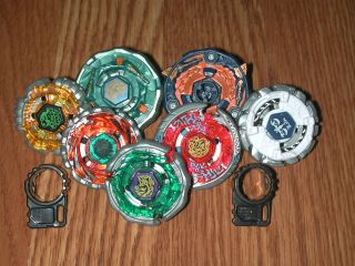 Beyblade Collection 7 Beyblades with Assorted Cords Wrenches Rippers 