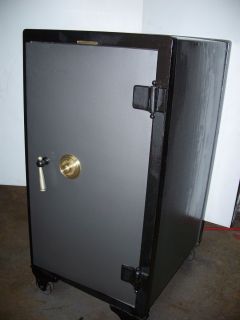 Tall antique safe cast iron type with combination