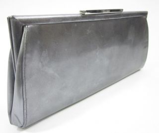 you are bidding on a calvin klein silver patent leather clutch handbag 