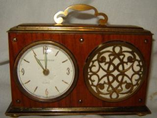 This is a nice vintage clock. It is an alarm clock and also plays Oh