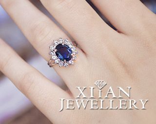Adjustable Diana Engagement Ring, Sapphire Surround By 14 Smaller
