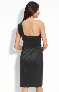 beaded medallion fashions the side of a satin one shoulder dress