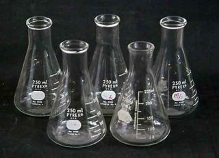 Four Pyrex Erlenmeyer flasks and one Kimax. They have been used and