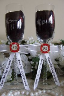 bride and groom etched on each glass white bows and ribbons adorned