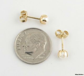 Each earring measures 3/16 (4.5mm) in diameter . The pair weighs a