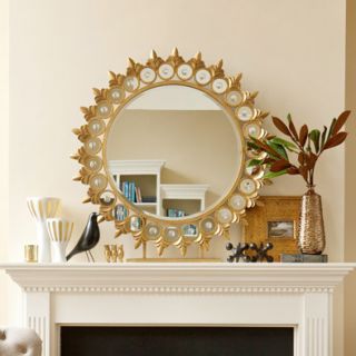 Go for glam this season with a show stopping starburst mirror (this