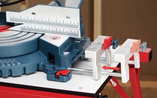 Sliding fences and base extensions increase the saws support capacity