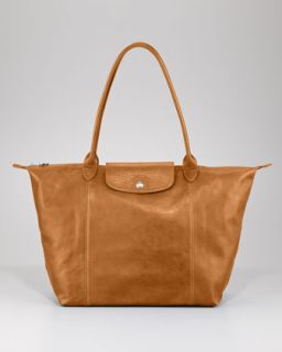  bag available in gunmetal bordeaux camel $ 525 00 longchamp le pliage