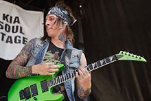 Falling in Reverses guitarist Jacky Vincent playing at Warped Tour