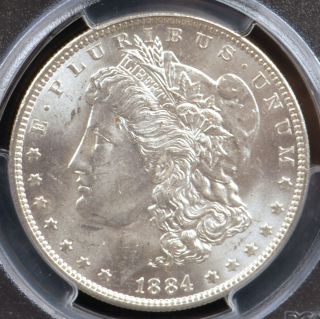 This is a 1884 O Morgan Silver Dollar graded and authenticated by PCGS