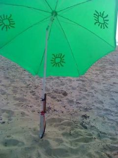 SANDLOK beach holder secures all umbrellas in sand&rods