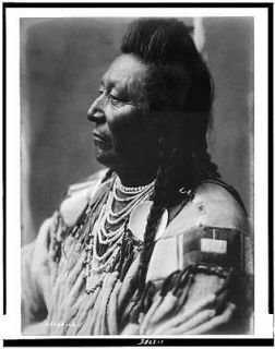 Plenty Coups,Crow Indian,pompadour,temple braids,beaded buckskin shirt
