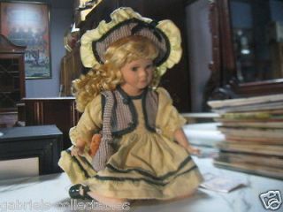 by Timeless Treasures 12 inch sitting porcelain doll with COA