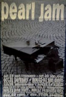 Pearl Jam 1990s tour poster man with piano on street playing in blue
