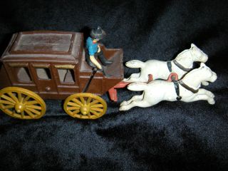 handmade cast iron stage coach & drvier withe horses ,moving wheels