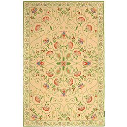 Hand hooked Bedford Beige/ Green Wool Rug (39 X 59) (BeigePattern FloralMeasures 0.375 inch thickTip We recommend the use of a non skid pad to keep the rug in place on smooth surfaces.All rug sizes are approximate. Due to the difference of monitor color