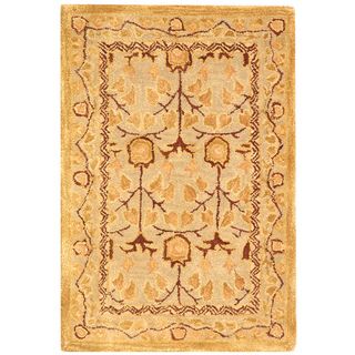 Handmade Ancestral Tree Ivory/ Gold Wool Rug (2 X 3) (IvoryPattern OrientalMeasures 0.625 inch thickTip We recommend the use of a non skid pad to keep the rug in place on smooth surfaces.All rug sizes are approximate. Due to the difference of monitor co