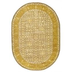 Handmade Majestic Beige/ Light Gold Wool Rug (46 X 66 Oval)